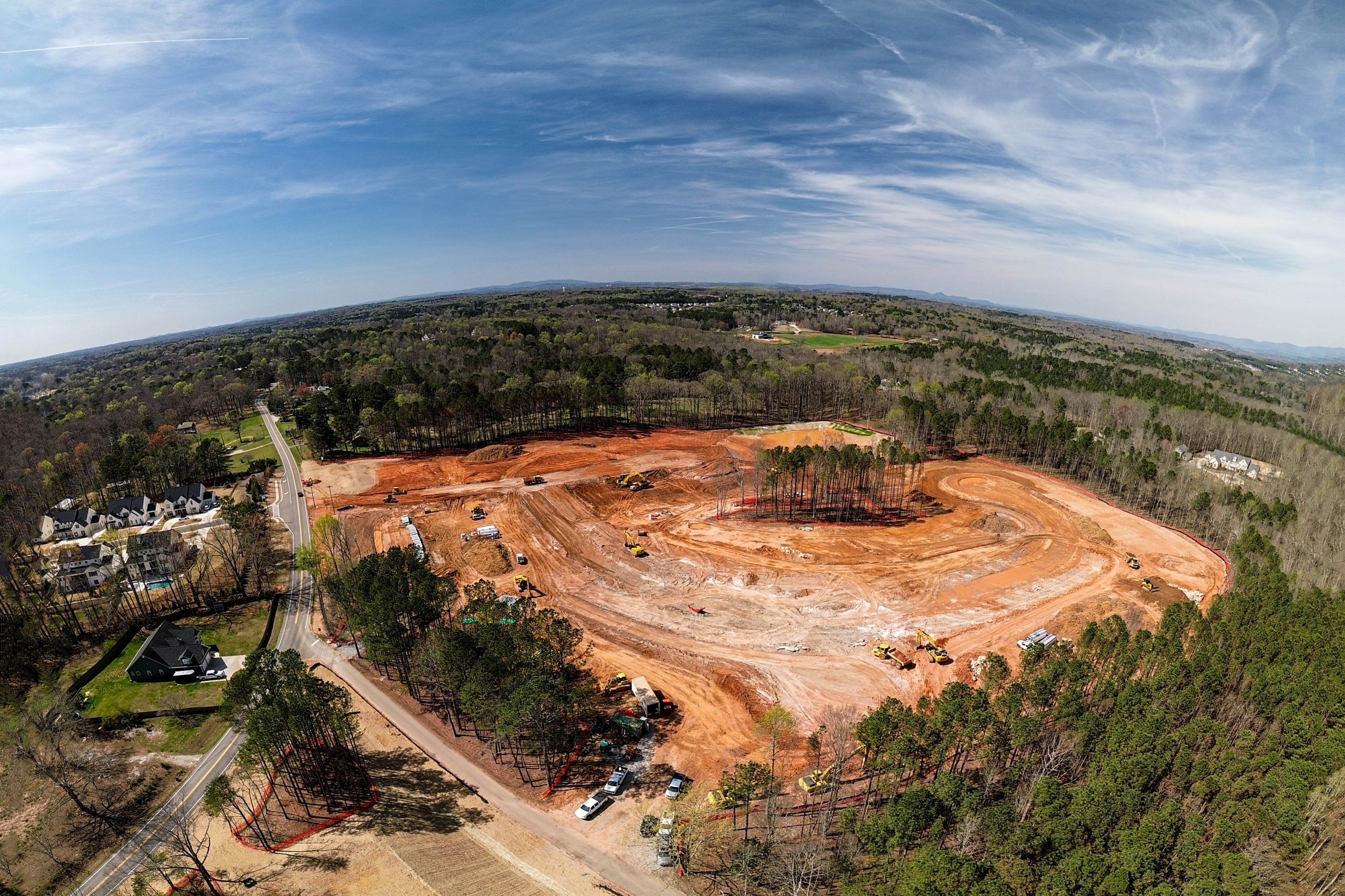 Full panoramic aerial view of active construction site